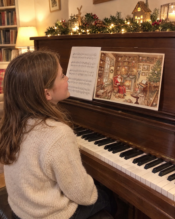 On the piano — The Heroines' Library advent calendar card at home